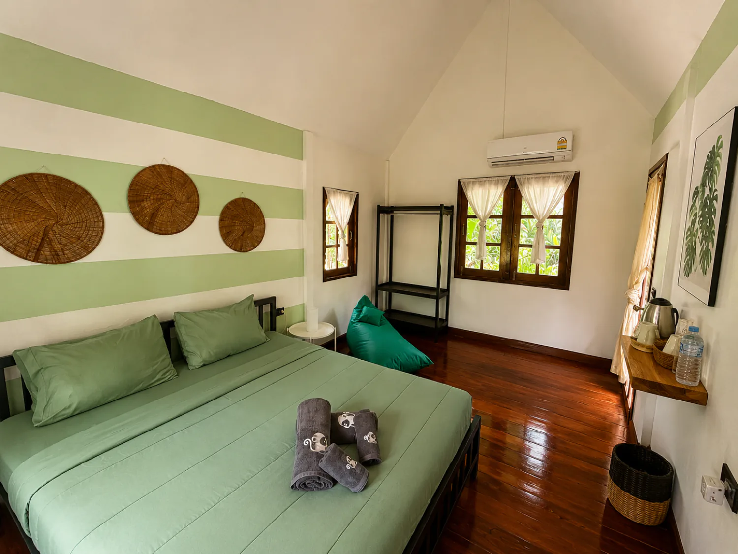 Second interior view of a Jungle Bungalow showing its natural materials and open layout