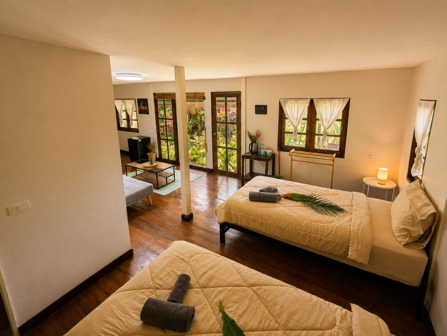 Twin sleeping area with two single beds inside a Jungle Villa at Vanara Eco Resort
