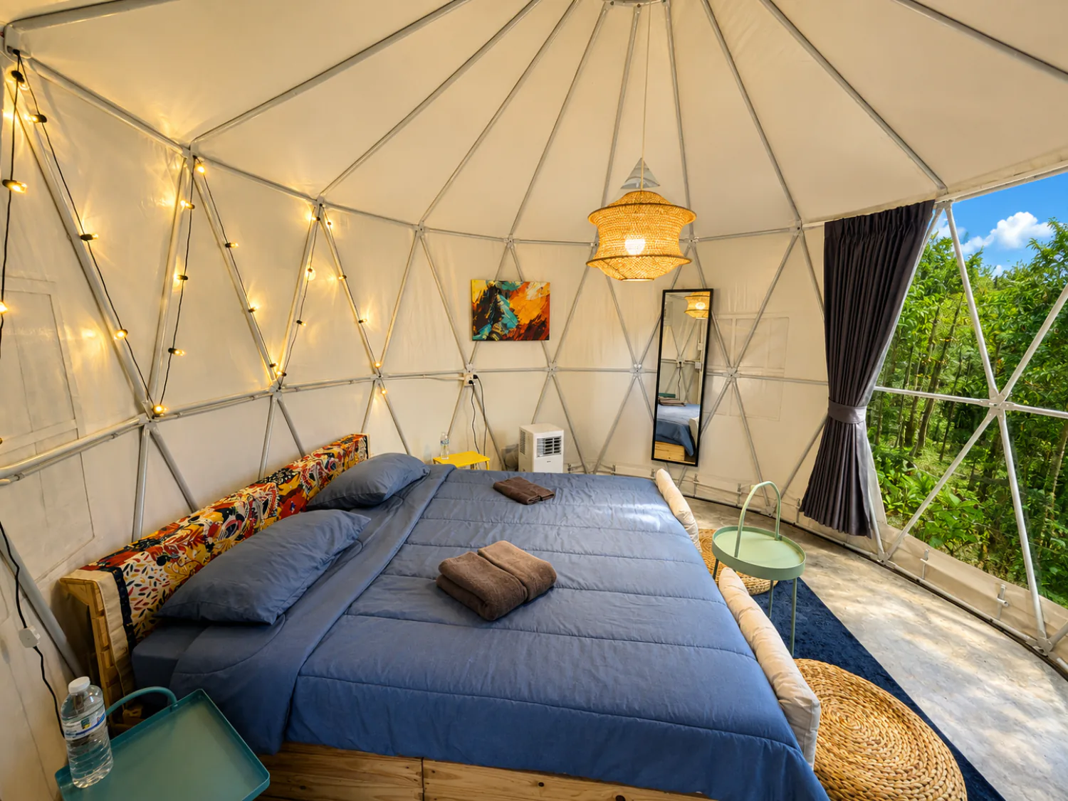 King-size bed inside a Glamping Yurt at Vanara Retreat