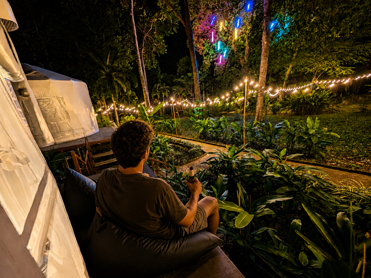 Private deck of a Glamping Yurt at night at Vanara Eco Resort